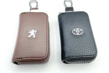 جاسوئیچی و کیف ریموت چرم خودرو با لوگوی تویوتا و پژو 14030768