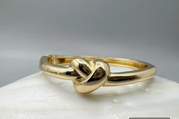 دستبند استیل طلایی طرح گره زنانه رنگ ثابت|14040633