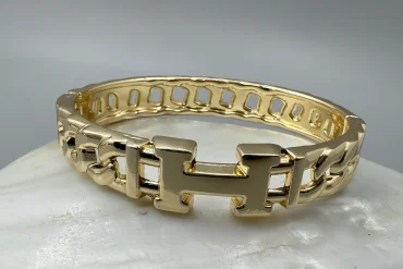 دستبند استیل طلایی طرح گره زنانه رنگ ثابت|14040634